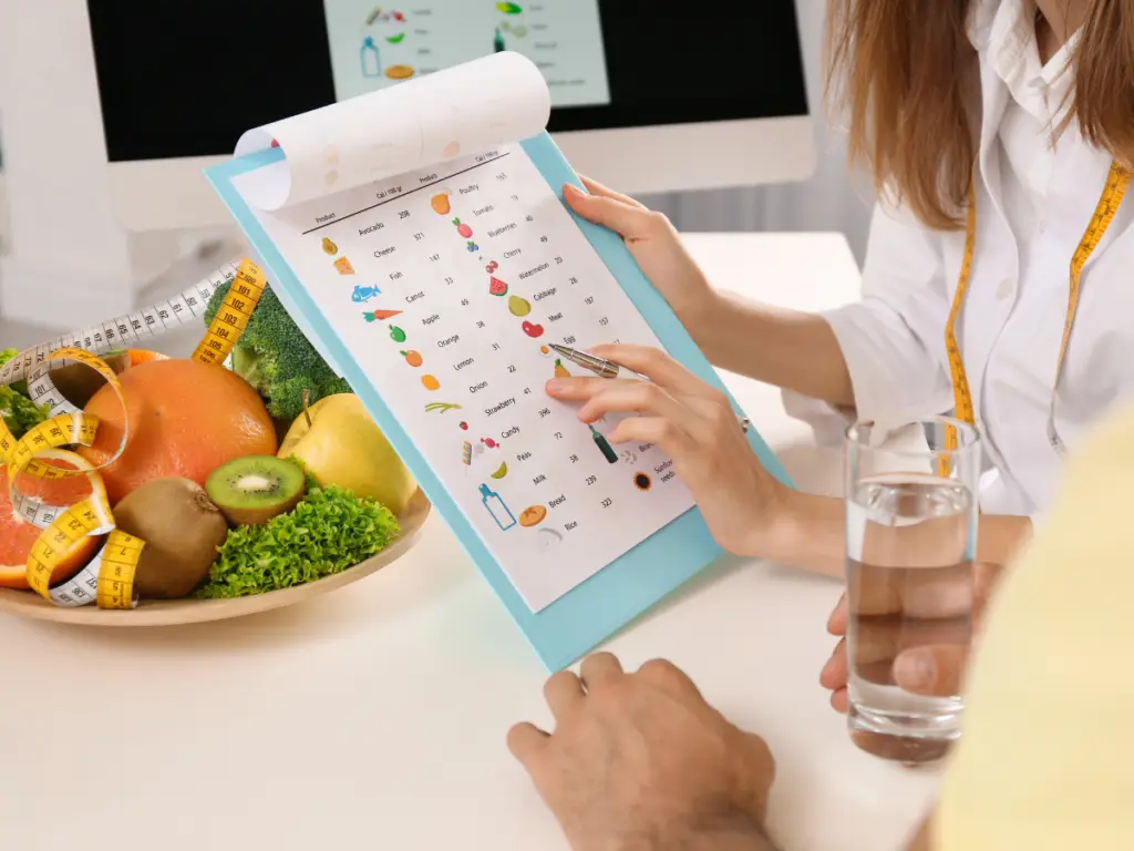 Dietitian reviewing a nutrition plan with a client - Healthy meal planning session